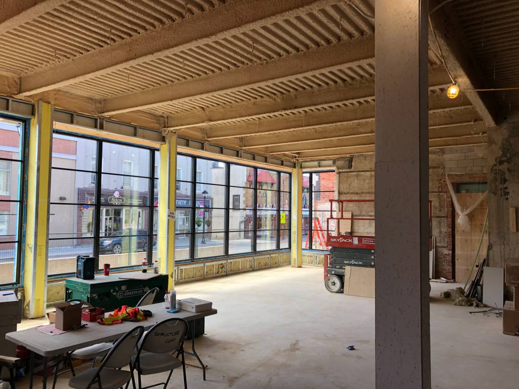 Interior view of the Picton Hotel renovation featuring Reynaers Aluminum SL38 windows designed to replicate the classic steel look while maximizing natural light.